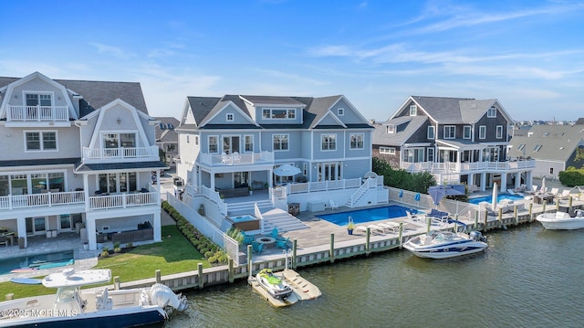 rear view of property with a water view