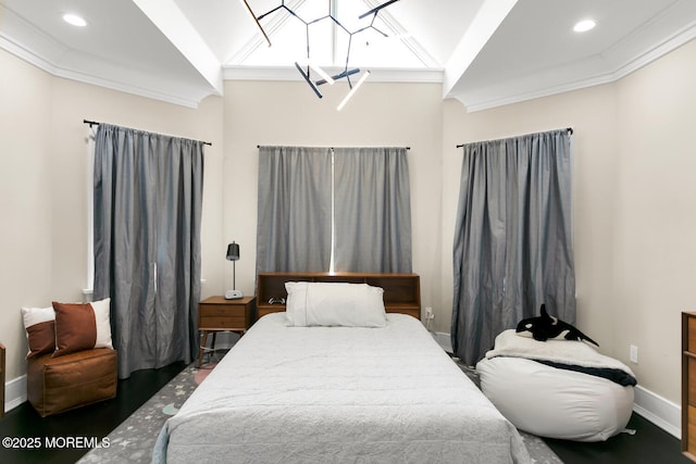 bedroom with crown molding, dark hardwood / wood-style floors, and lofted ceiling