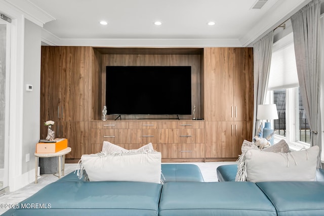 living room featuring wooden walls and ornamental molding