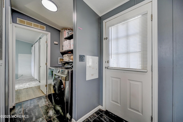 doorway with washing machine and dryer and vaulted ceiling