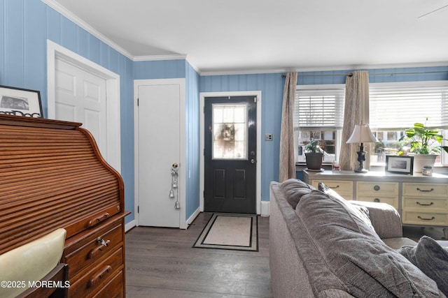 entryway featuring dark hardwood / wood-style floors and crown molding