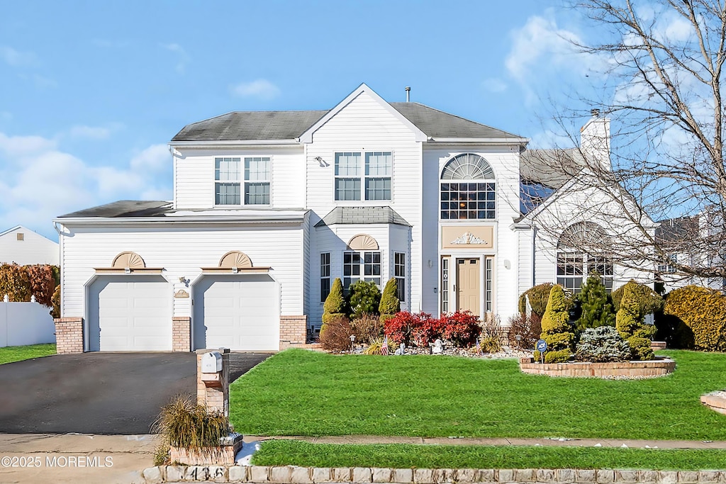 436 Matthews Ln, Jackson, NJ 08527 - front facade featuring a front yard and a garage