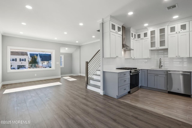 kitchen featuring appliances with stainless steel finishes, white cabinets, and sink