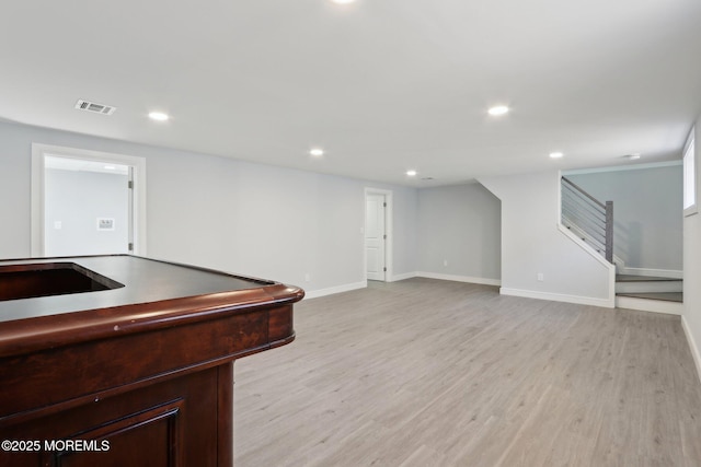 interior space featuring sink and light hardwood / wood-style flooring