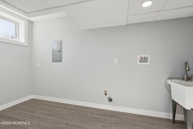 laundry room with washer hookup, electric panel, and dark hardwood / wood-style floors