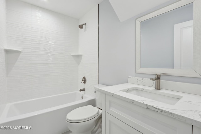 full bathroom with toilet, vanity, and tiled shower / bath