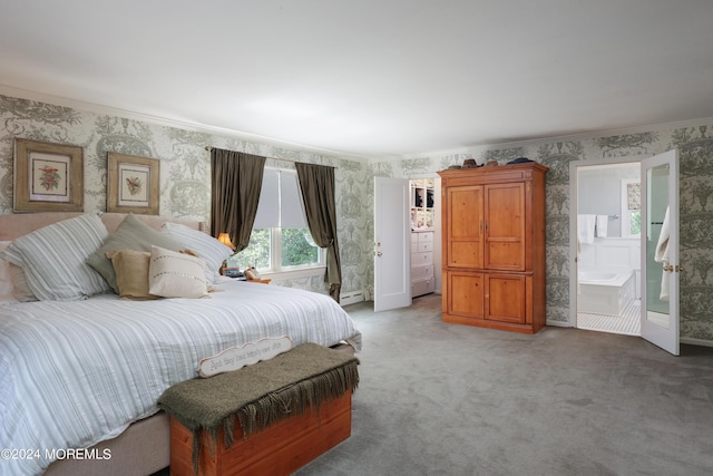 bedroom featuring baseboard heating, connected bathroom, crown molding, and carpet floors