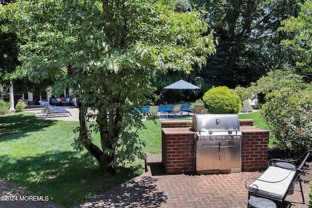 view of patio with a grill and exterior kitchen