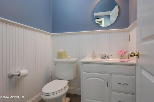 bathroom featuring vanity and toilet