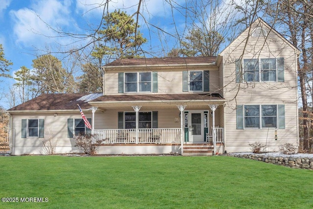 view of front facade with covered porch and a front yard