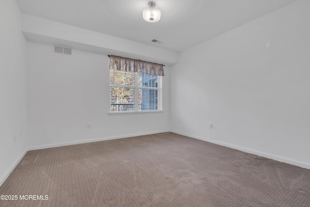 empty room featuring carpet flooring