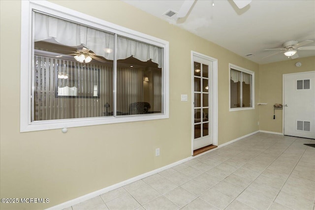 spare room featuring light tile patterned floors