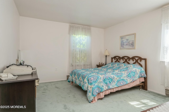 bedroom featuring light colored carpet