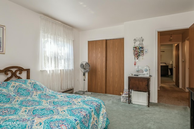 bedroom with light carpet and a closet