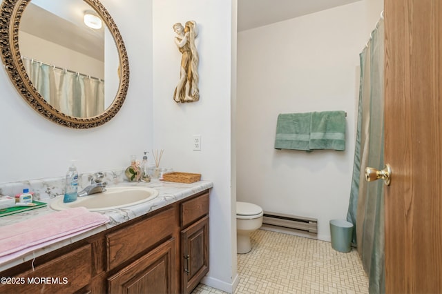 bathroom with tile patterned floors, vanity, toilet, and baseboard heating