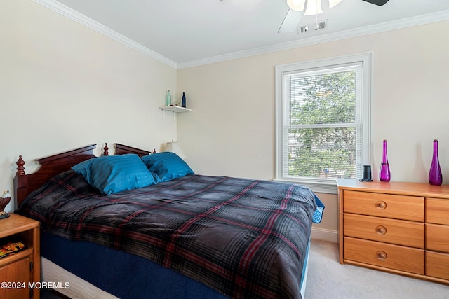 bedroom featuring multiple windows, ceiling fan, ornamental molding, and light carpet