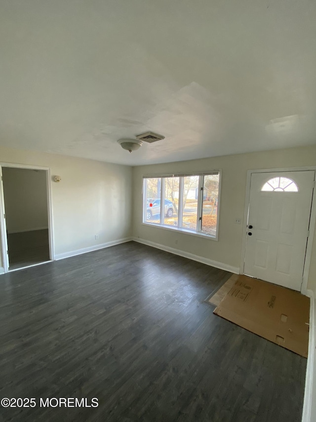 foyer with dark wood-type flooring