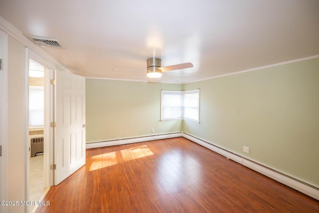 unfurnished room with ceiling fan, hardwood / wood-style floors, radiator heating unit, ornamental molding, and a baseboard radiator