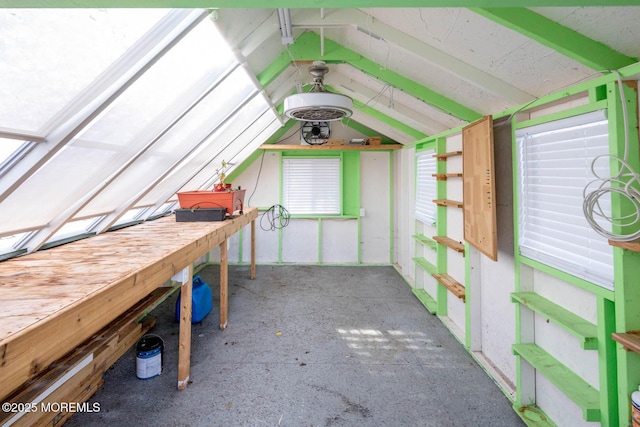 unfurnished sunroom featuring lofted ceiling