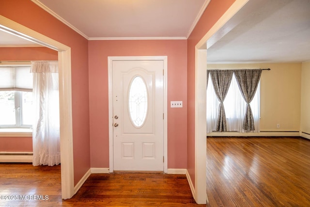 entryway featuring crown molding, a baseboard radiator, and hardwood / wood-style floors