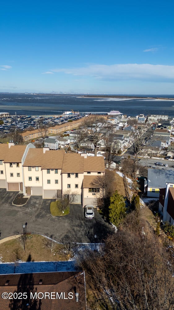 drone / aerial view featuring a water view