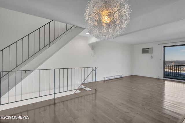 unfurnished living room featuring a chandelier, hardwood / wood-style floors, a baseboard radiator, and a wall mounted air conditioner