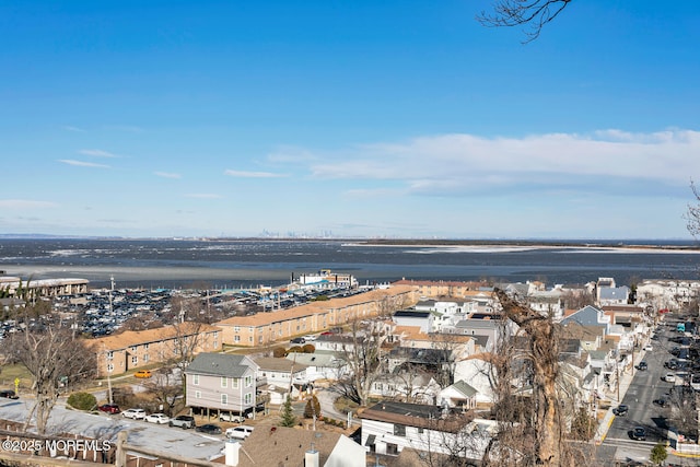 birds eye view of property featuring a water view