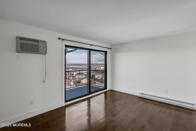 unfurnished room featuring a wall mounted air conditioner, dark hardwood / wood-style flooring, and a baseboard heating unit