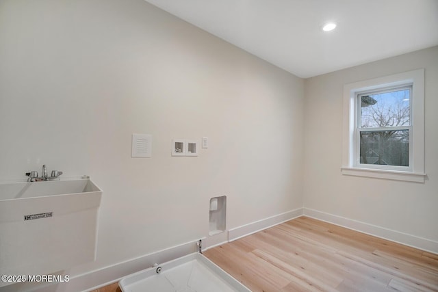 laundry area featuring hookup for a washing machine, light wood-style flooring, hookup for a gas dryer, laundry area, and baseboards