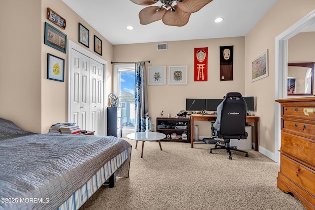 bedroom featuring carpet, a closet, and ceiling fan