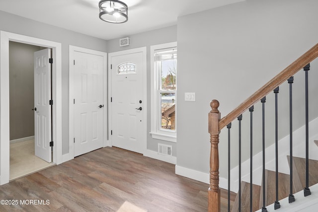 foyer entrance featuring hardwood / wood-style floors