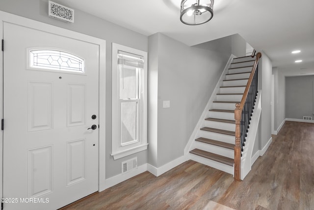 foyer entrance with hardwood / wood-style flooring