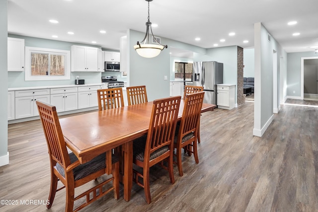 dining room featuring light hardwood / wood-style floors