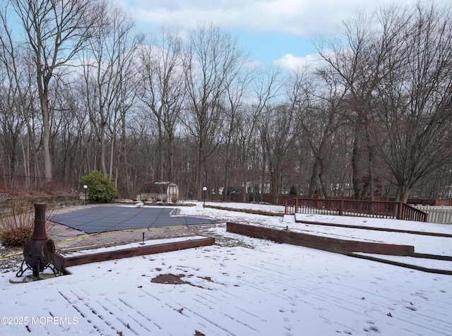 view of yard layered in snow