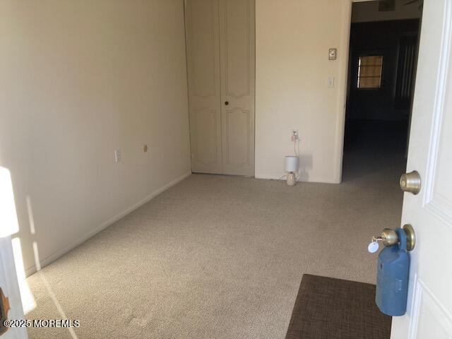 unfurnished room with carpet flooring