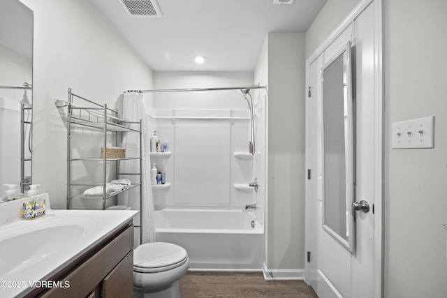 full bathroom with vanity, wood-type flooring, shower / bath combo, and toilet