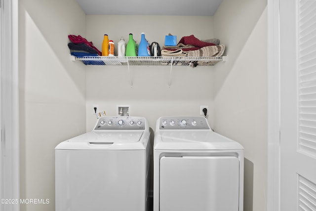 washroom with washer and dryer