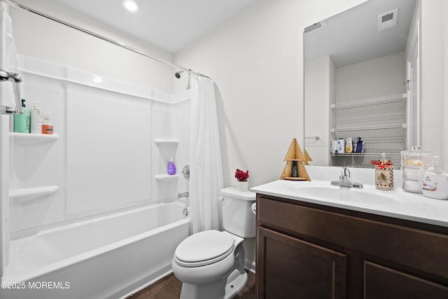 full bathroom with shower / tub combo with curtain, vanity, and toilet