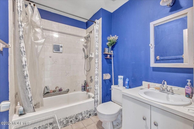 full bathroom with toilet, tile patterned flooring, vanity, and shower / tub combo with curtain