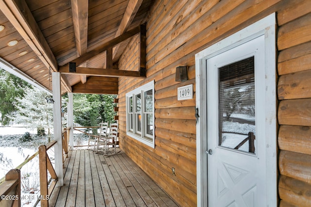 view of snow covered deck