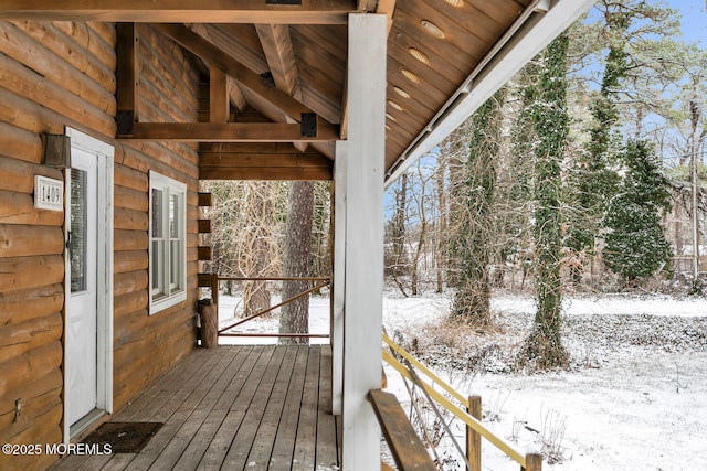 view of snow covered deck