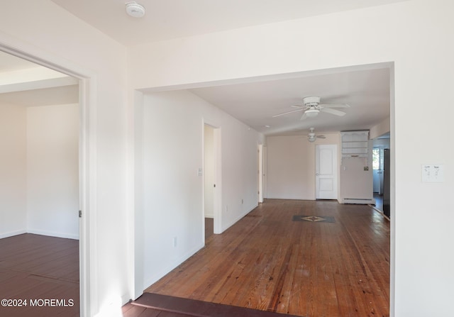 corridor with dark hardwood / wood-style floors