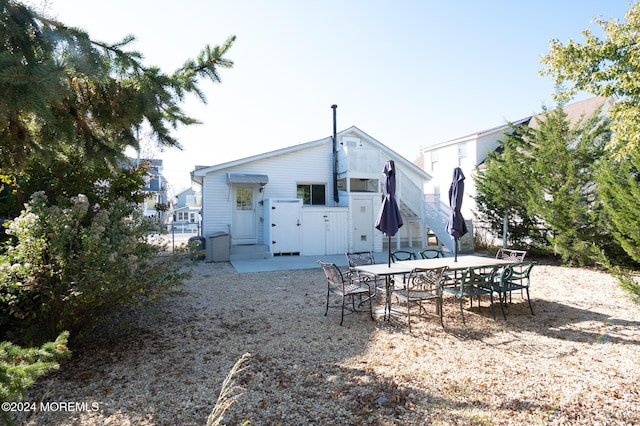 rear view of house featuring a patio area