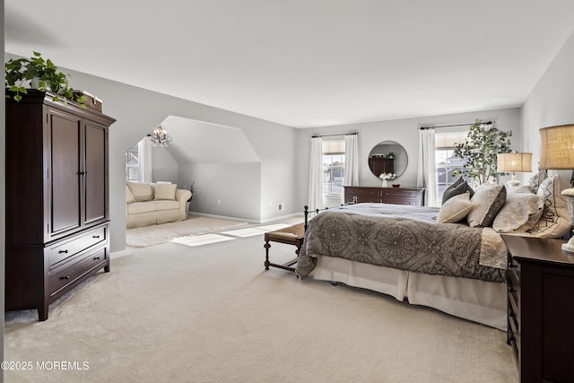 bedroom with light carpet, vaulted ceiling, an inviting chandelier, and baseboards