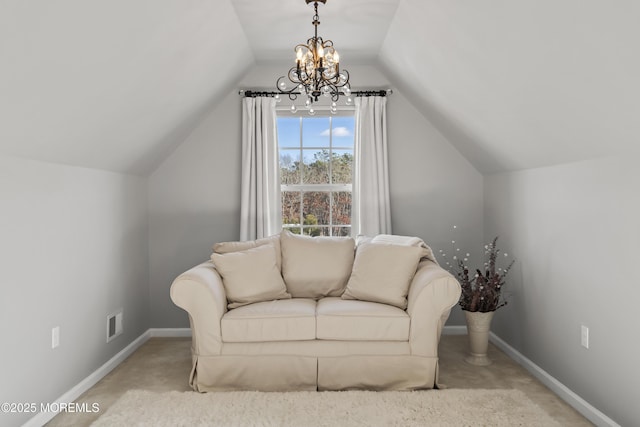 sitting room featuring light colored carpet, lofted ceiling, and a chandelier