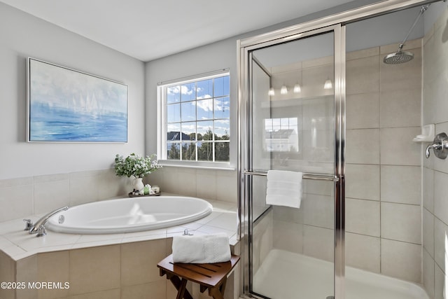 full bath featuring a garden tub and a shower stall