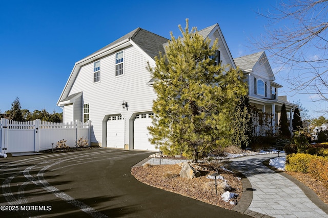 view of home's exterior featuring a garage