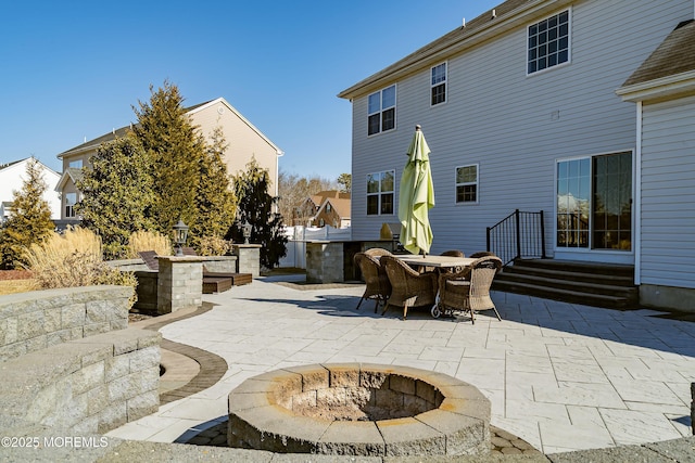 view of patio featuring an outdoor fire pit