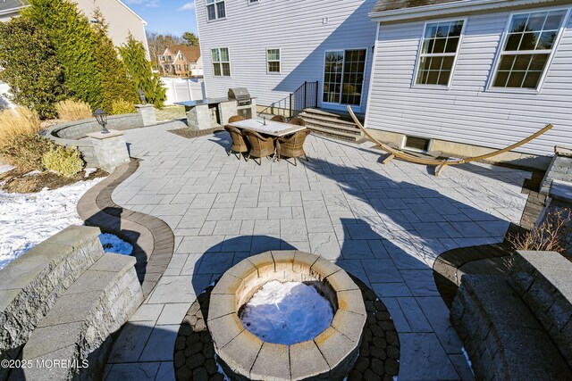 view of patio / terrace with an outdoor fire pit and area for grilling