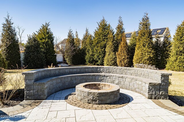 view of patio with an outdoor fire pit